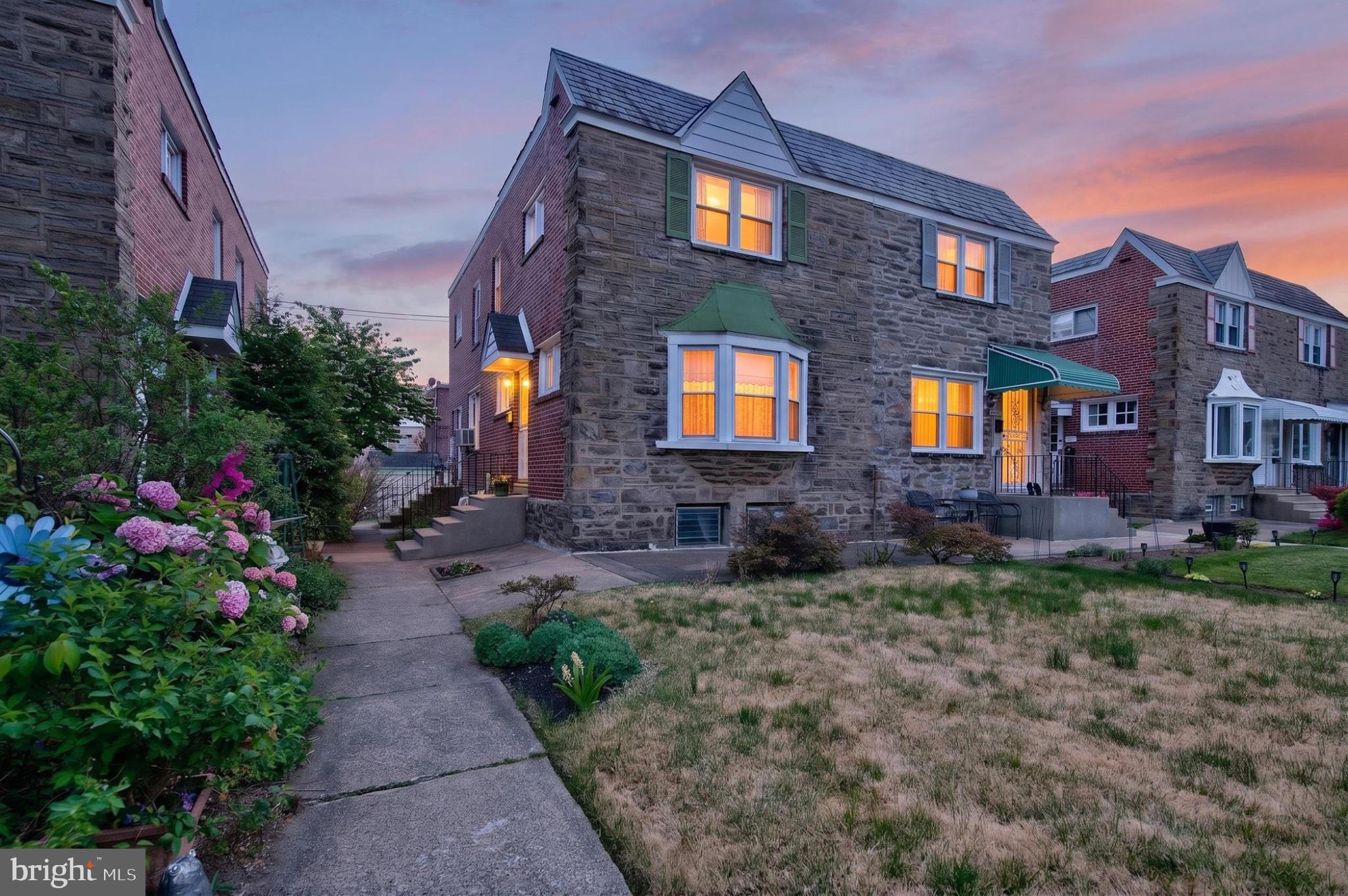 2006 Vista Street Philadelphia, PA 19152 - Photo 1 of 18 a front view of a house with a yard