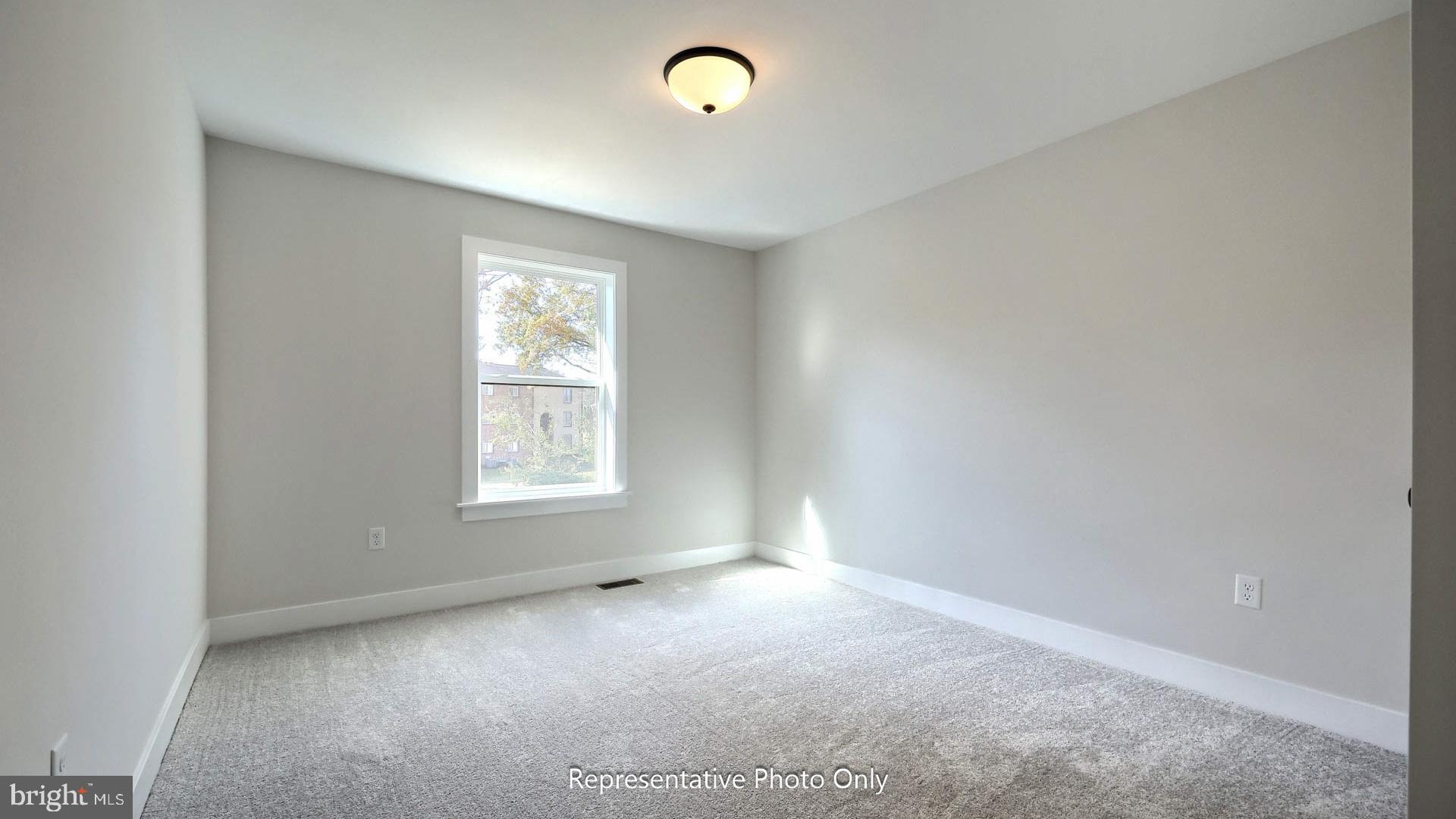 80 Tupelo Street Lititz, PA 17543 - Photo 19 of 22 a view of empty room with window and fireplace