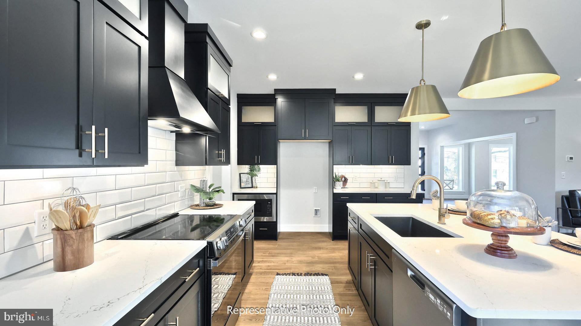 80 Tupelo Street Lititz, PA 17543 - Photo 9 of 22 a kitchen with stainless steel appliances granite countertop a sink stove and refrigerator