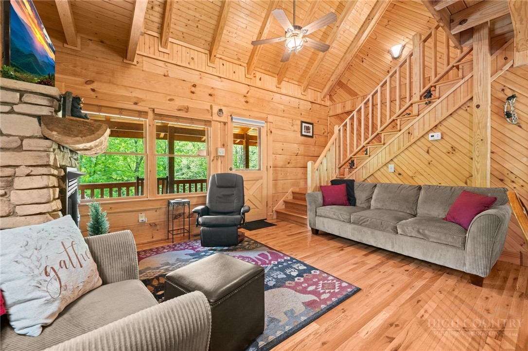 613 Silas Creek Road Lansing, NC 28643 - Photo 13 of 40 a living room with furniture a rug and a large window