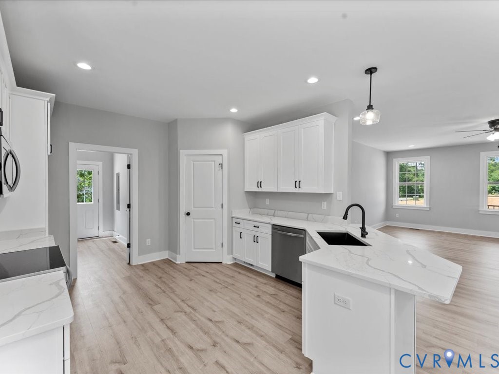 517 Frenchs Store Road Cumberland, VA 23040 - Photo 11 of 22 a kitchen with a sink stove and cabinets
