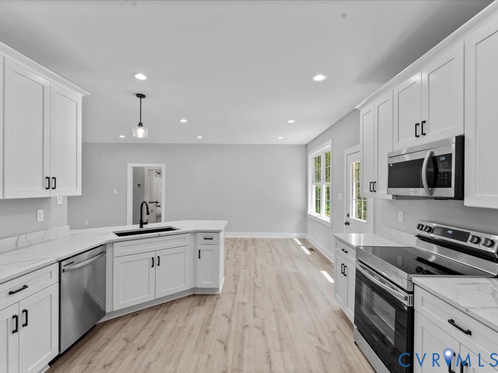 517 Frenchs Store Road Cumberland, VA 23040 - Photo 14 of 22 a kitchen with stainless steel appliances granite countertop a sink stove and refrigerator