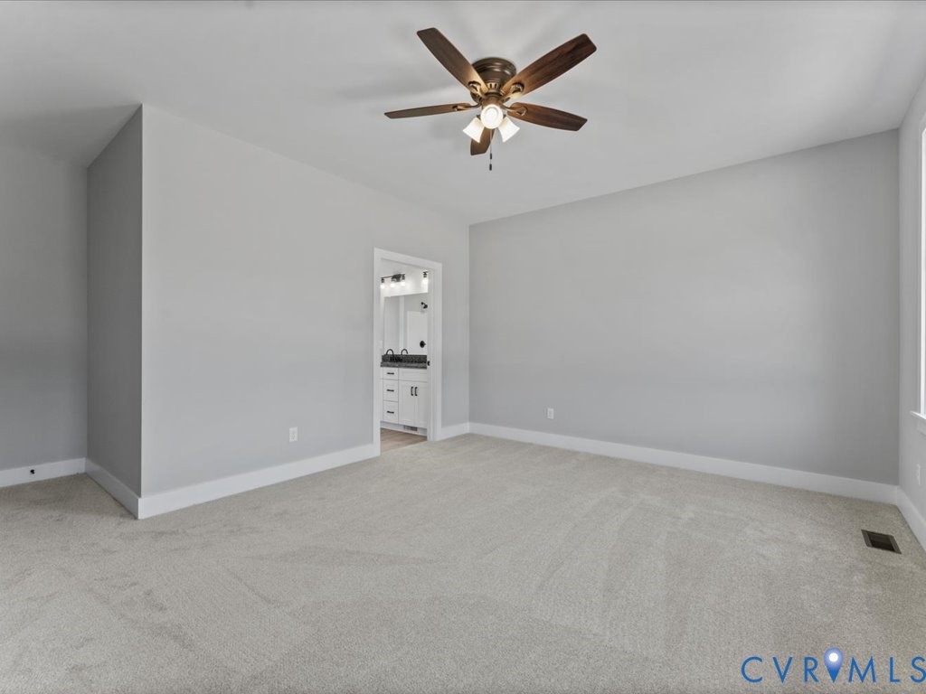 517 Frenchs Store Road Cumberland, VA 23040 - Photo 18 of 22 an empty room with closet and fan