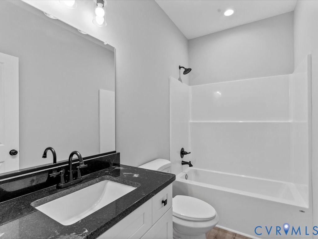 517 Frenchs Store Road Cumberland, VA 23040 - Photo 21 of 22 a bathroom with a sink toilet tub and shower