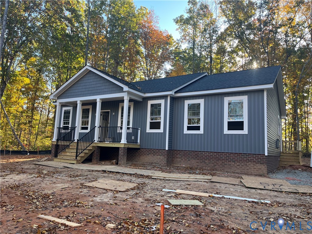 517 Frenchs Store Road Cumberland, VA 23040 - Photo 3 of 22 a front view of a house with garden