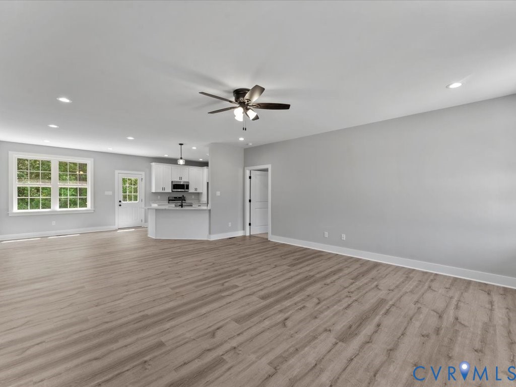 517 Frenchs Store Road Cumberland, VA 23040 - Photo 7 of 22 a view of an empty room with a window and wooden floor