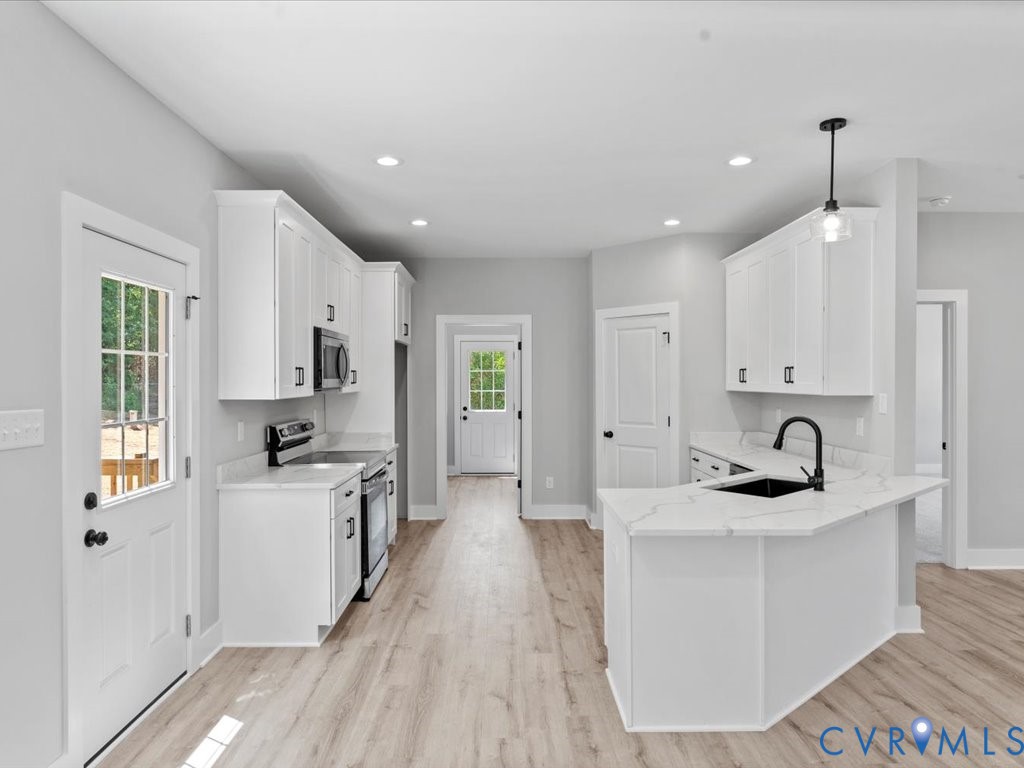 517 Frenchs Store Road Cumberland, VA 23040 - Photo 9 of 22 a kitchen with stainless steel appliances kitchen island granite countertop a sink and cabinets