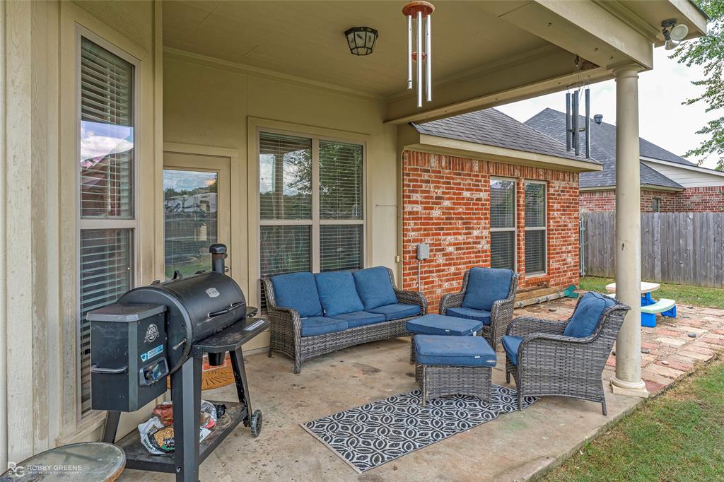 711 Reeds Reef Bossier City, LA 71112 - Photo 30 of 36 a outdoor living space with furniture and a potted plant