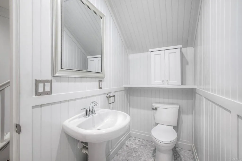 4302 Pacifica Way, Unit 2 Oceanside, NY 11572 - Photo 13 of 51 a bathroom with a sink and a toilet