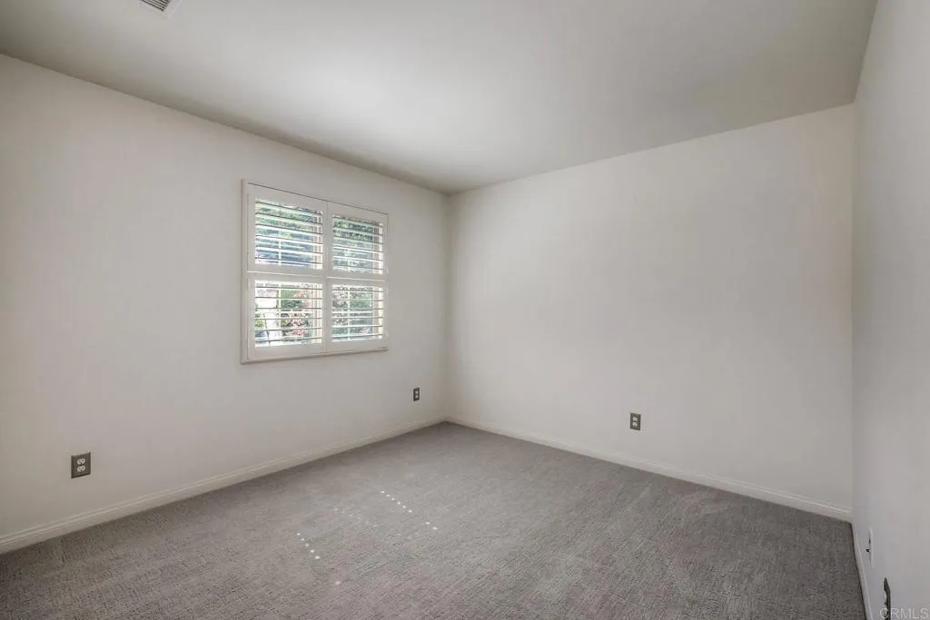 4302 Pacifica Way, Unit 2 Oceanside, NY 11572 - Photo 29 of 51 an empty room with a window