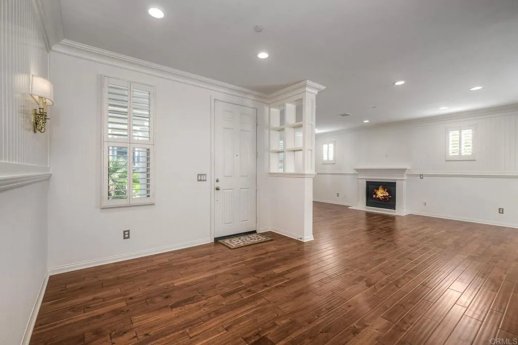 4302 Pacifica Way, Unit 2 Oceanside, NY 11572 - Photo 9 of 51 a view of empty room with wooden floor and fan