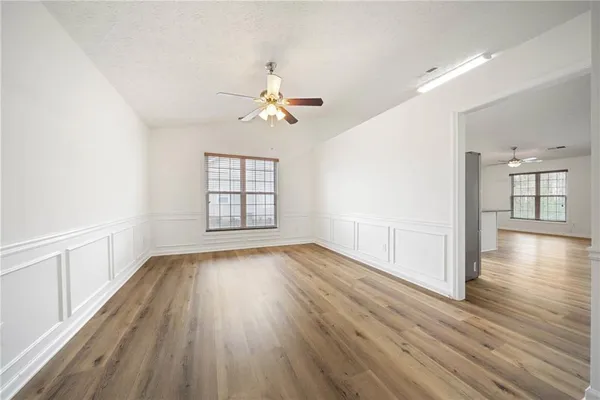 wooden floor in an empty room with a window