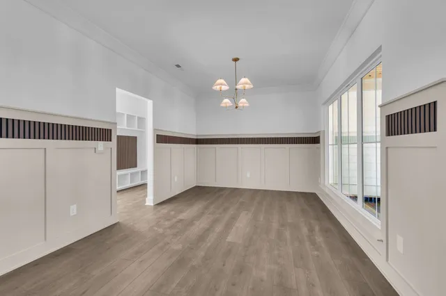 a bathroom with a toilet a sink and a window
