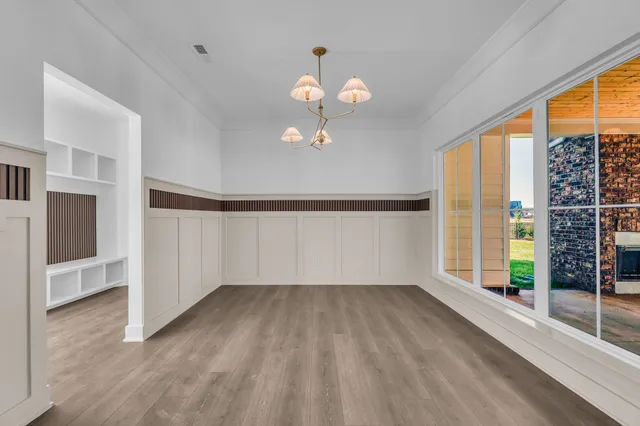 a kitchen with cabinets and window
