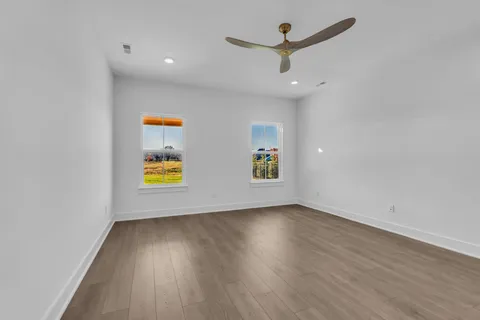 a spacious bathroom with a bathtub sink and mirror