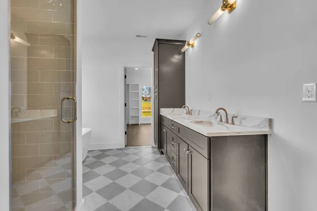 an empty room with wooden floor and window