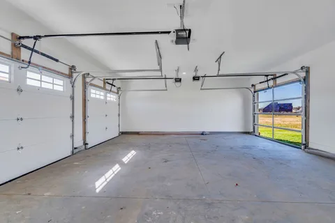 a front view of a house with a yard table and chairs