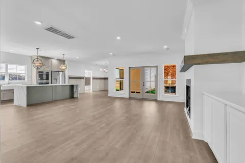a view of a kitchen with a sink and a refrigerator
