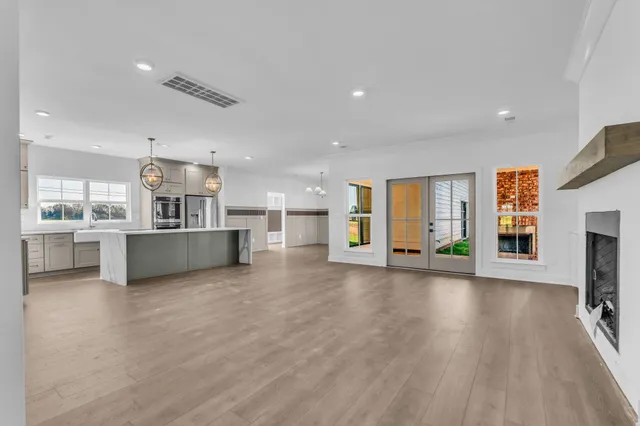 a view of a kitchen with a sink and a stove top oven