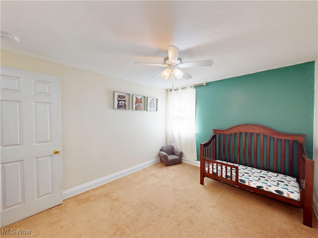 1136 Erieview Road Cleveland Heights, OH 44121 - Photo 26 of 45 Bedroom featuring carpet floors, a textured ceiling, and ceiling fan