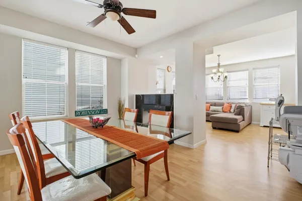 a bedroom with furniture and a large window