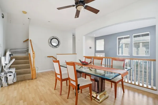 a view of a dining room with furniture window and wooden floor
