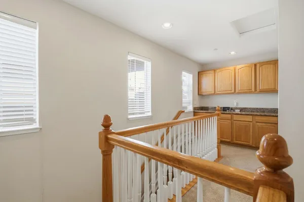a view of kitchen with granite countertop window