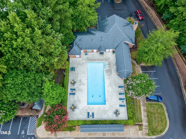 an aerial view of a house with outdoor space