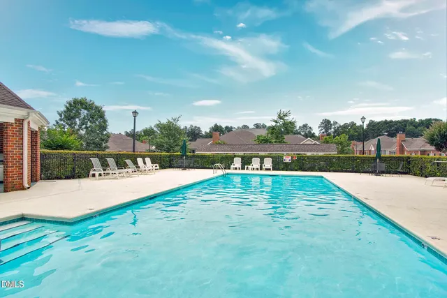 a view of yard and swimming pool