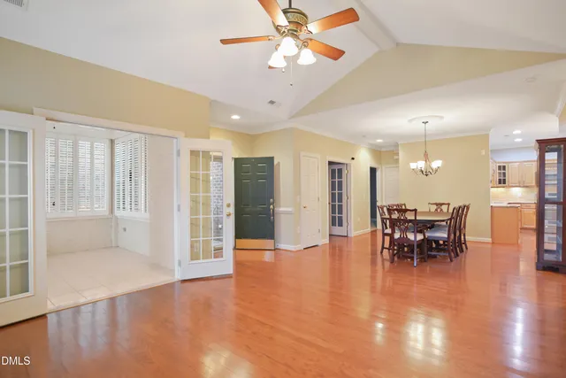 a view of a room with furniture and wooden floor