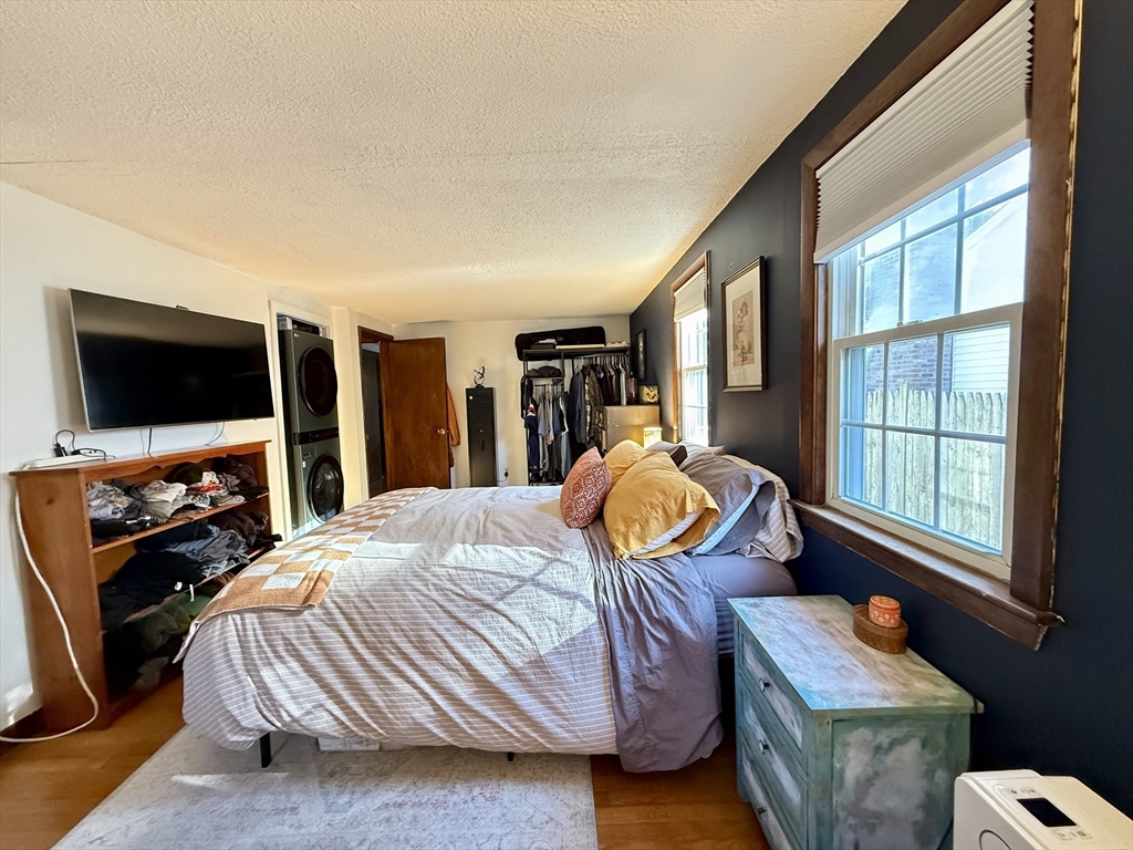 23 Circuit Road North Yarmouth, MA 02673 - Photo 17 of 34 a bed room with a bed television and a large window