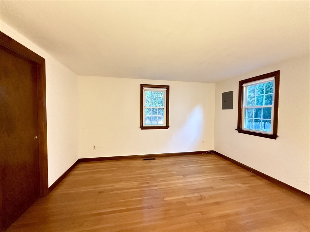 23 Circuit Road North Yarmouth, MA 02673 - Photo 19 of 34 a view of an empty room with wooden floor and a window