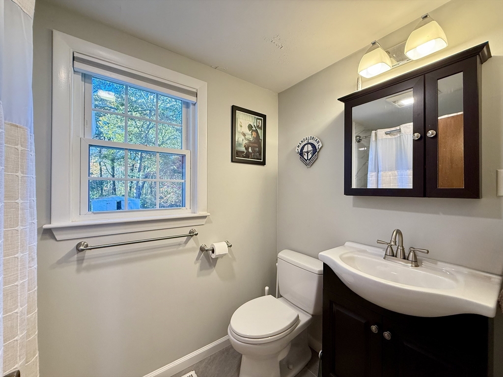 23 Circuit Road North Yarmouth, MA 02673 - Photo 23 of 34 a bathroom with a toilet a sink and mirror