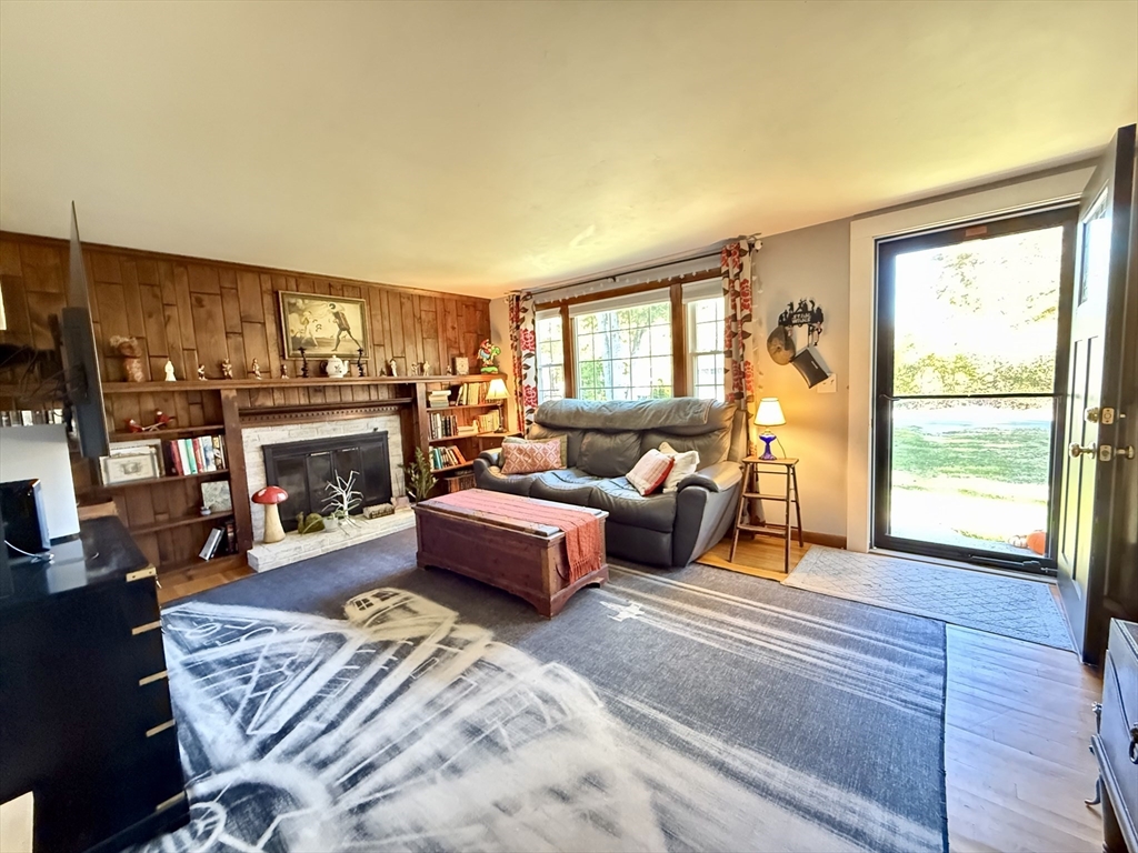 23 Circuit Road North Yarmouth, MA 02673 - Photo 7 of 34 a living room with furniture large window and a fireplace