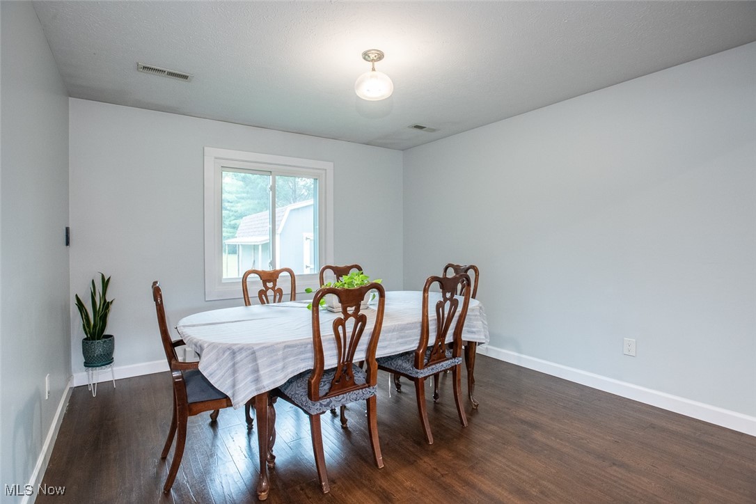 3434 Hamlin Road Medina, OH 44256 - Photo 9 of 37 Dining area featuring dark hardwood / wood-style flooring