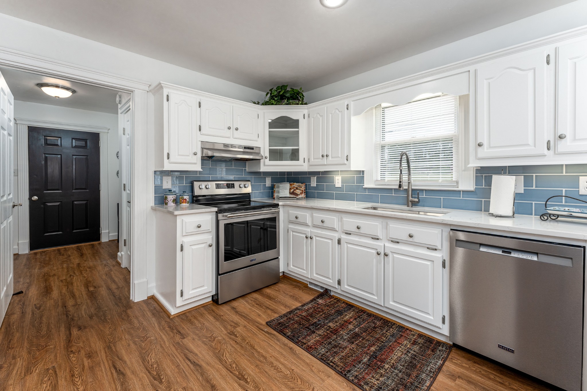 7 South Patrick Road Fayetteville, TN 37334 - Photo 19 of 32 a kitchen with stainless steel appliances granite countertop a stove a sink dishwasher and a refrigerator