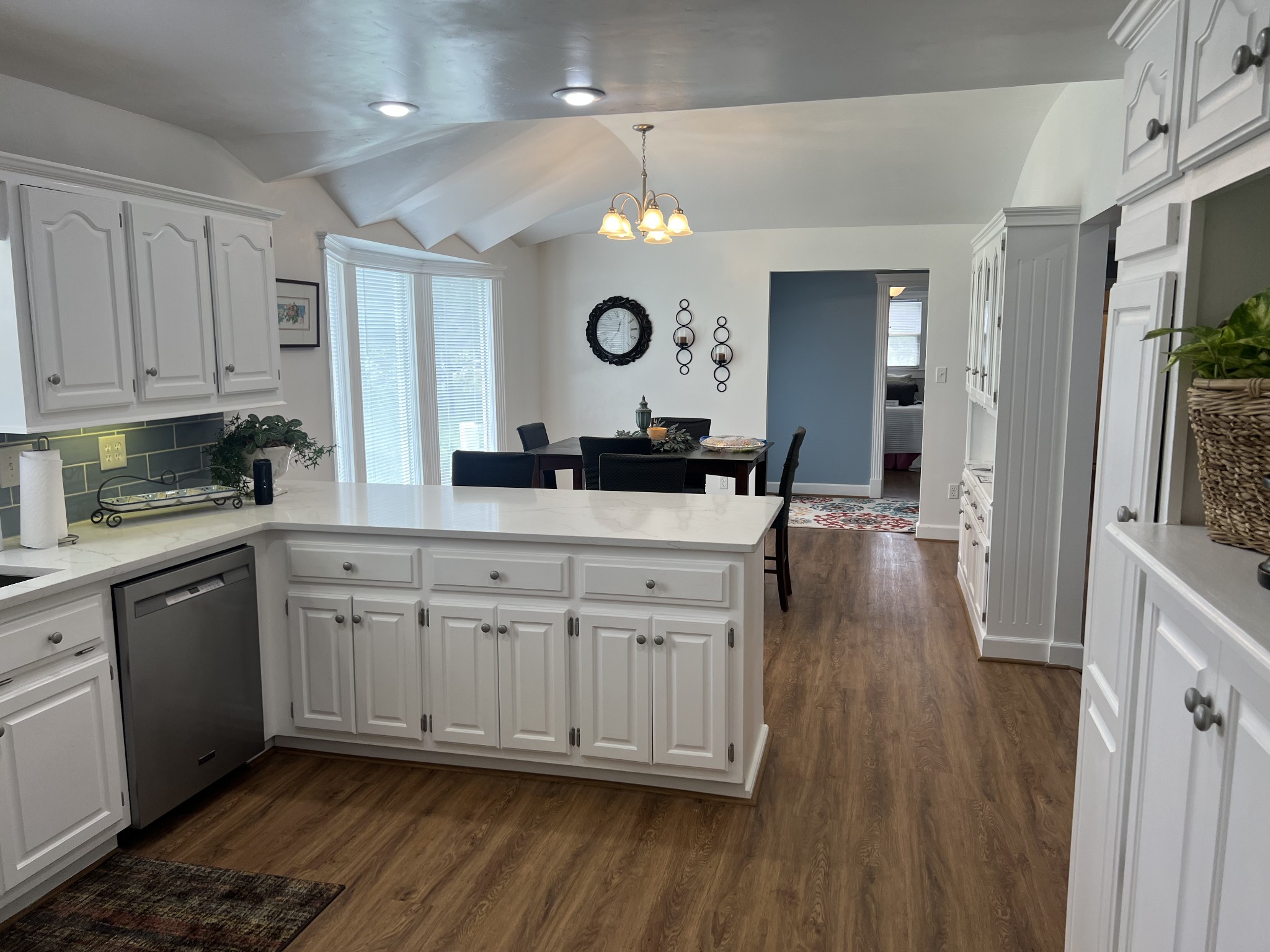 7 South Patrick Road Fayetteville, TN 37334 - Photo 31 of 32 a kitchen with a sink dishwasher a dining table and chairs with wooden floor