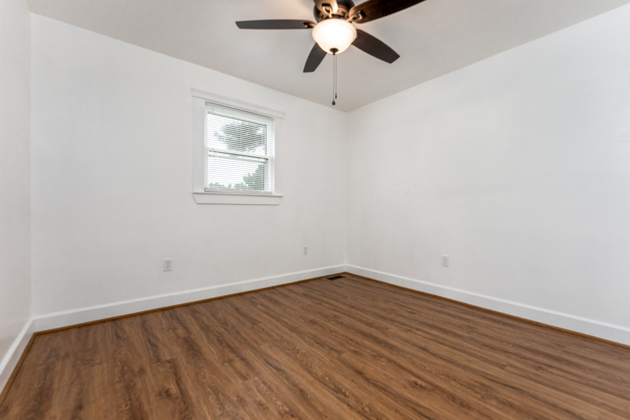 7 South Patrick Road Fayetteville, TN 37334 - Photo 9 of 32 wooden floor in an empty room with a window