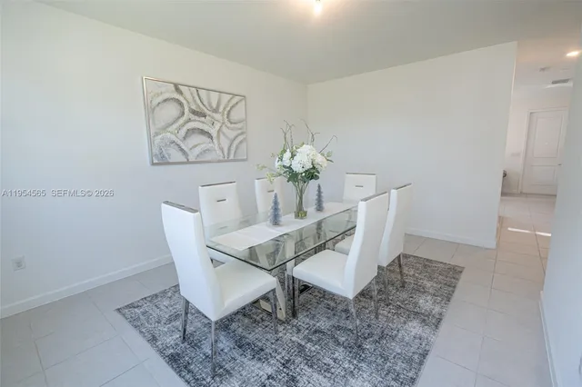 a view of staircase with white walls and a window
