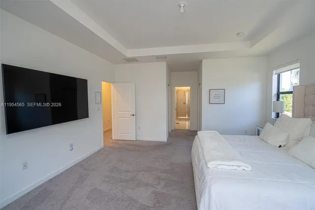 a bedroom with a bed and a table