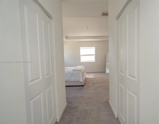 a view of a swimming pool with outdoor seating