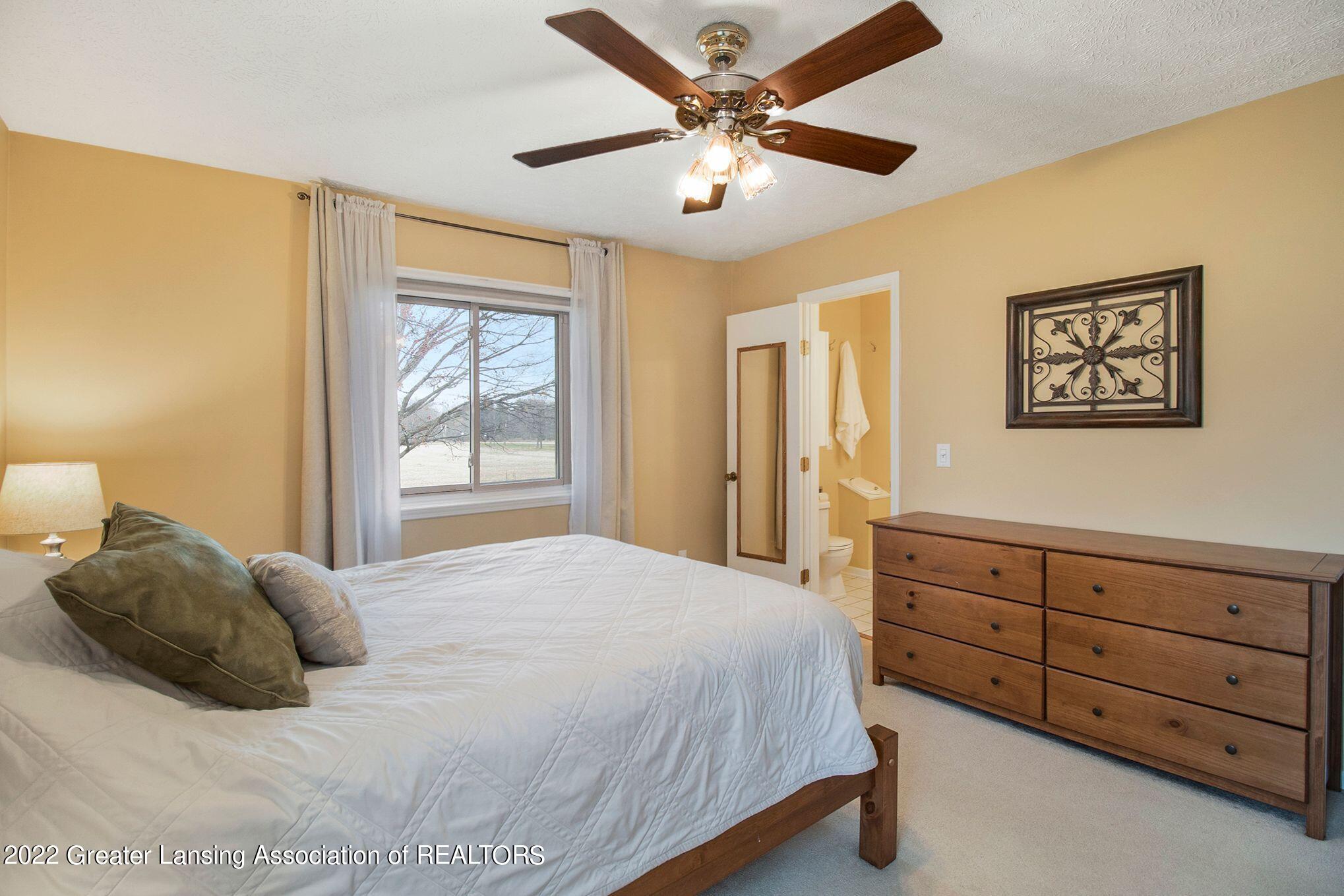 11976 Ransom Highway Dimondale, MI 48821 - Photo 17 of 33 Primary bedroom w/ attached bath