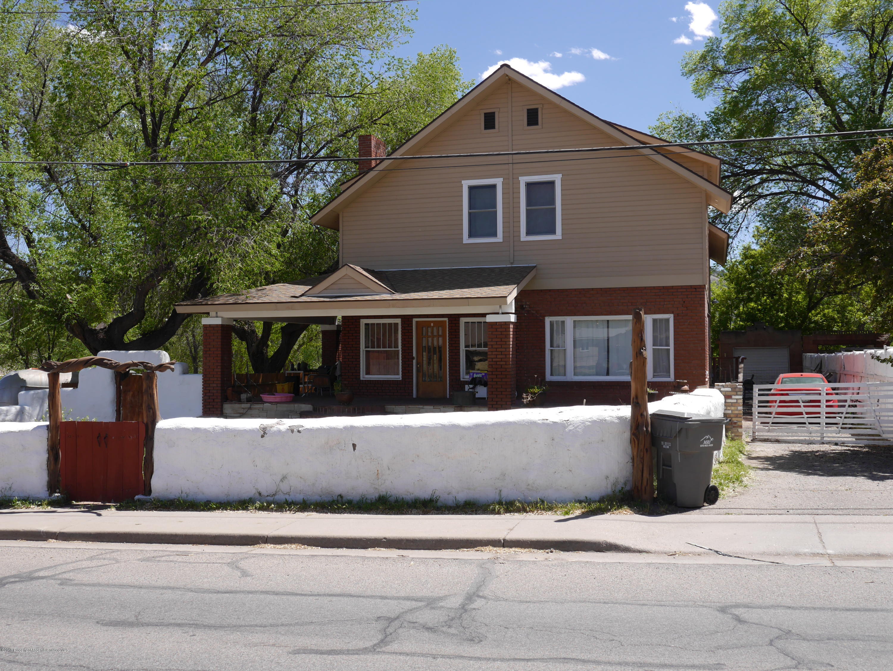 425 West 3rd Street Rifle, CO 81650 - Photo 1 of 14 a front view of a house with a yard