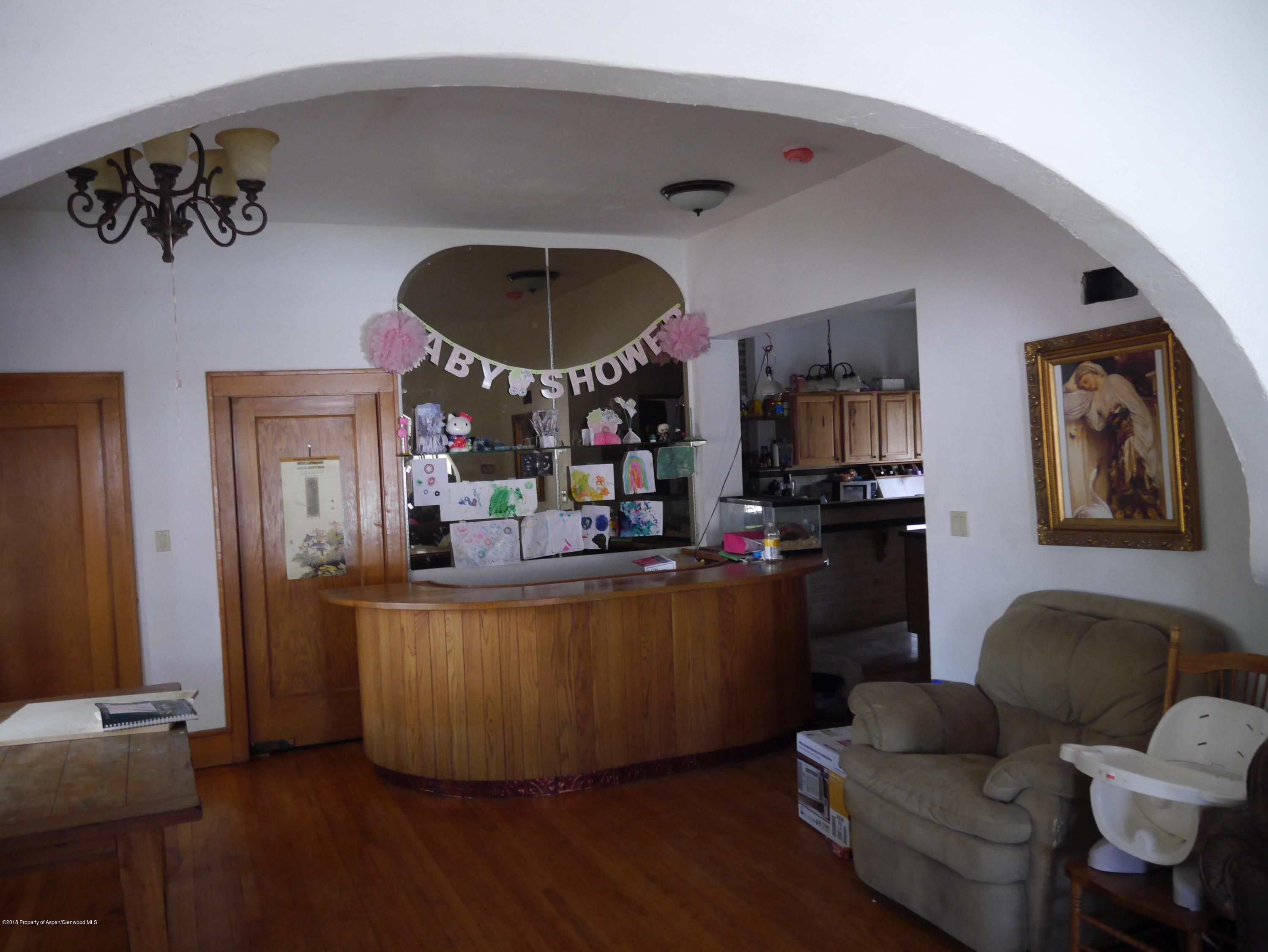 425 West 3rd Street Rifle, CO 81650 - Photo 11 of 14 a living room with furniture and a large window