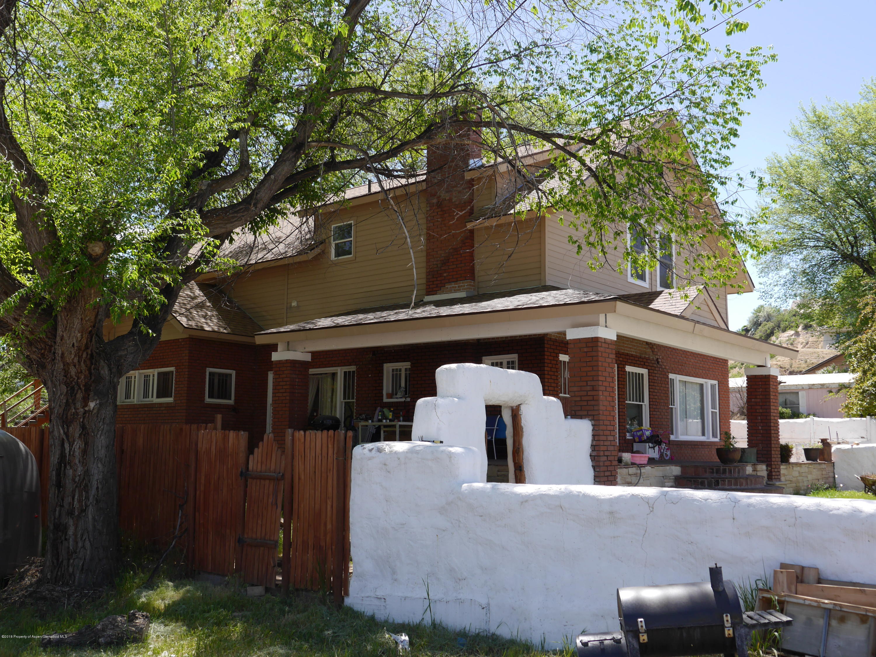 425 West 3rd Street Rifle, CO 81650 - Photo 2 of 14 a front view of house with yard and trees around