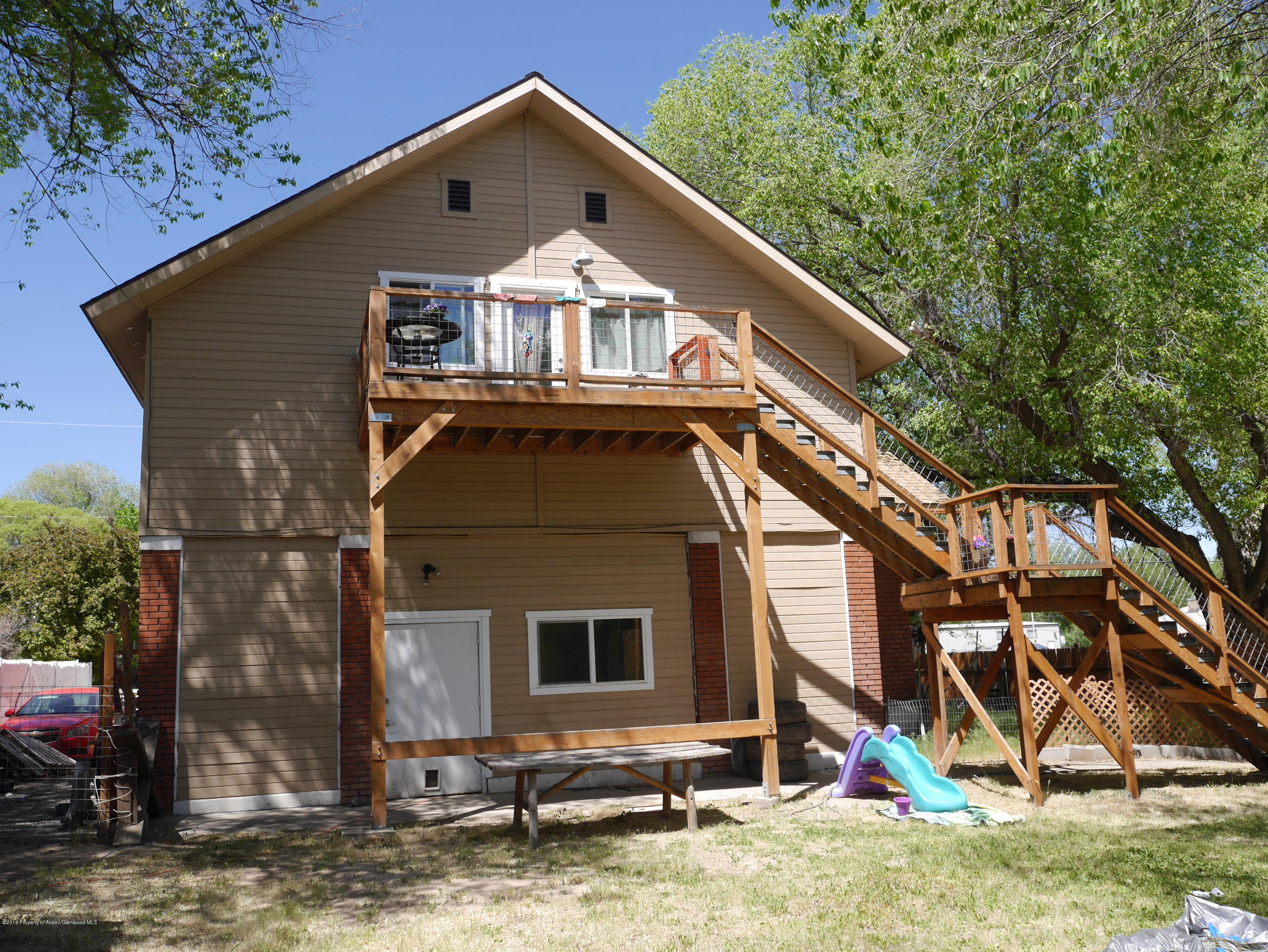 425 West 3rd Street Rifle, CO 81650 - Photo 3 of 14 a front view of a house with garden