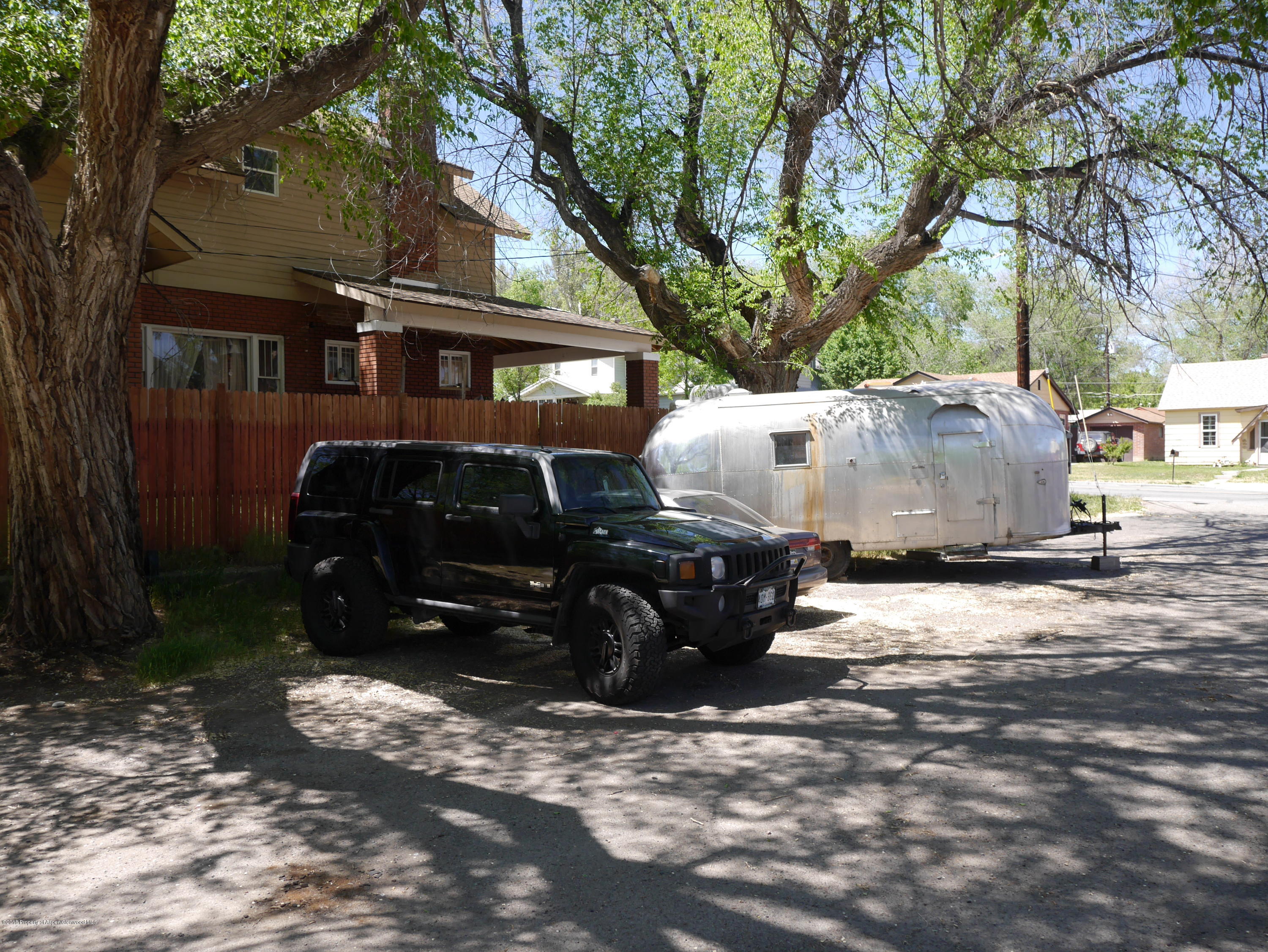 425 West 3rd Street Rifle, CO 81650 - Photo 4 of 14 a front view of a house with a yard