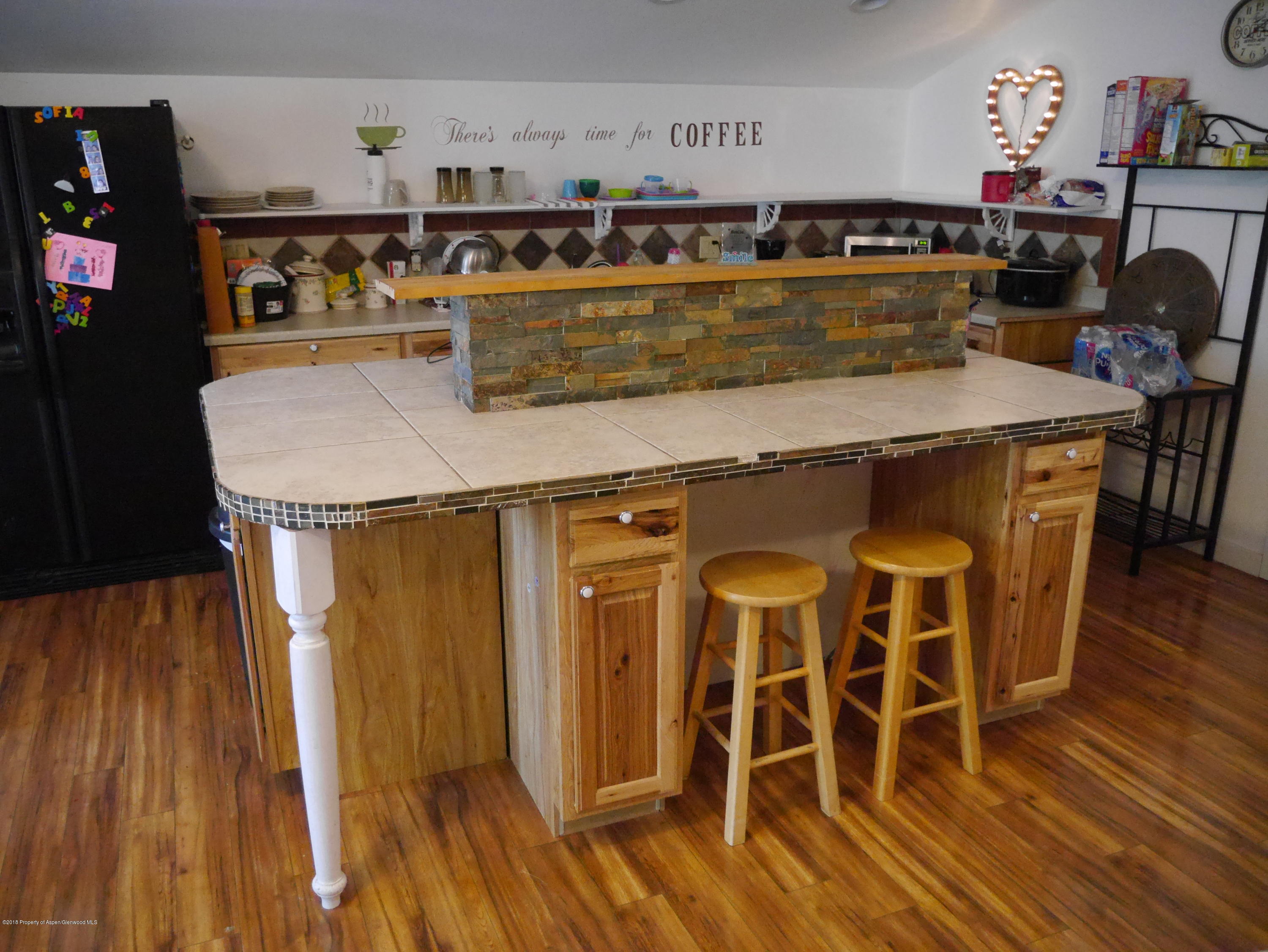 425 West 3rd Street Rifle, CO 81650 - Photo 5 of 14 a view of a dining table with chairs