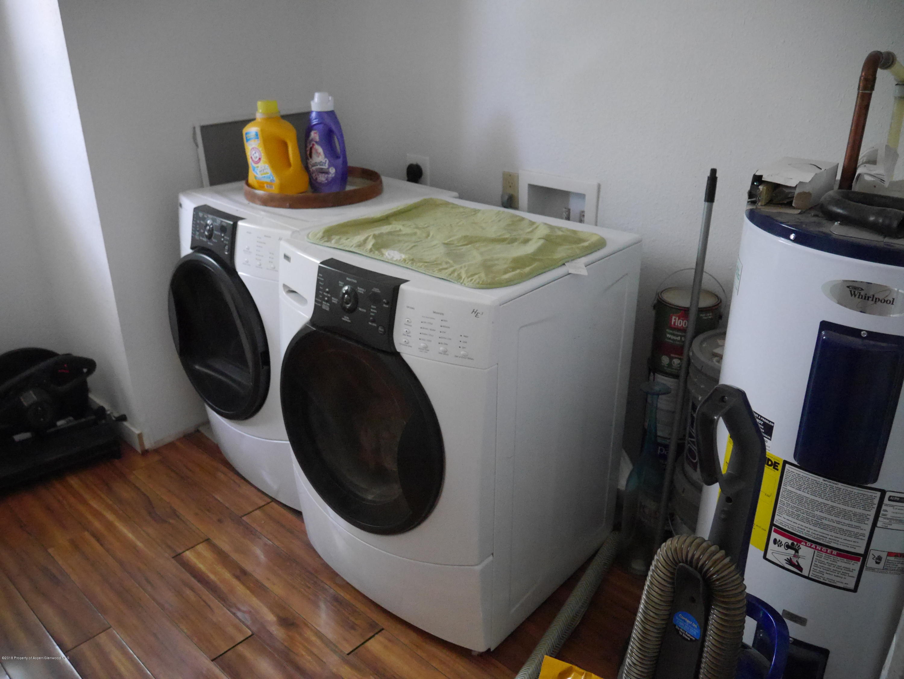 425 West 3rd Street Rifle, CO 81650 - Photo 6 of 14 a utility room with dryer washer and a view of living room