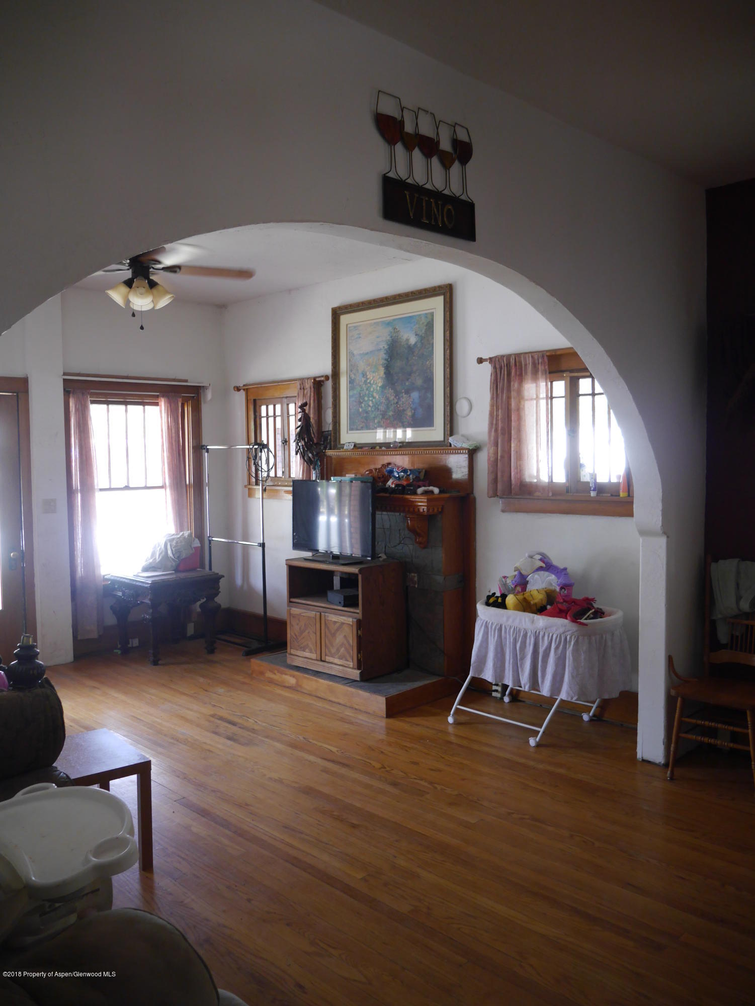 425 West 3rd Street Rifle, CO 81650 - Photo 10 of 14 a living room with furniture window and wooden floor
